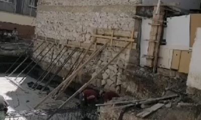 Yıkılan 3 katlı binayı tahtlarla tutmaya çalışmışlar